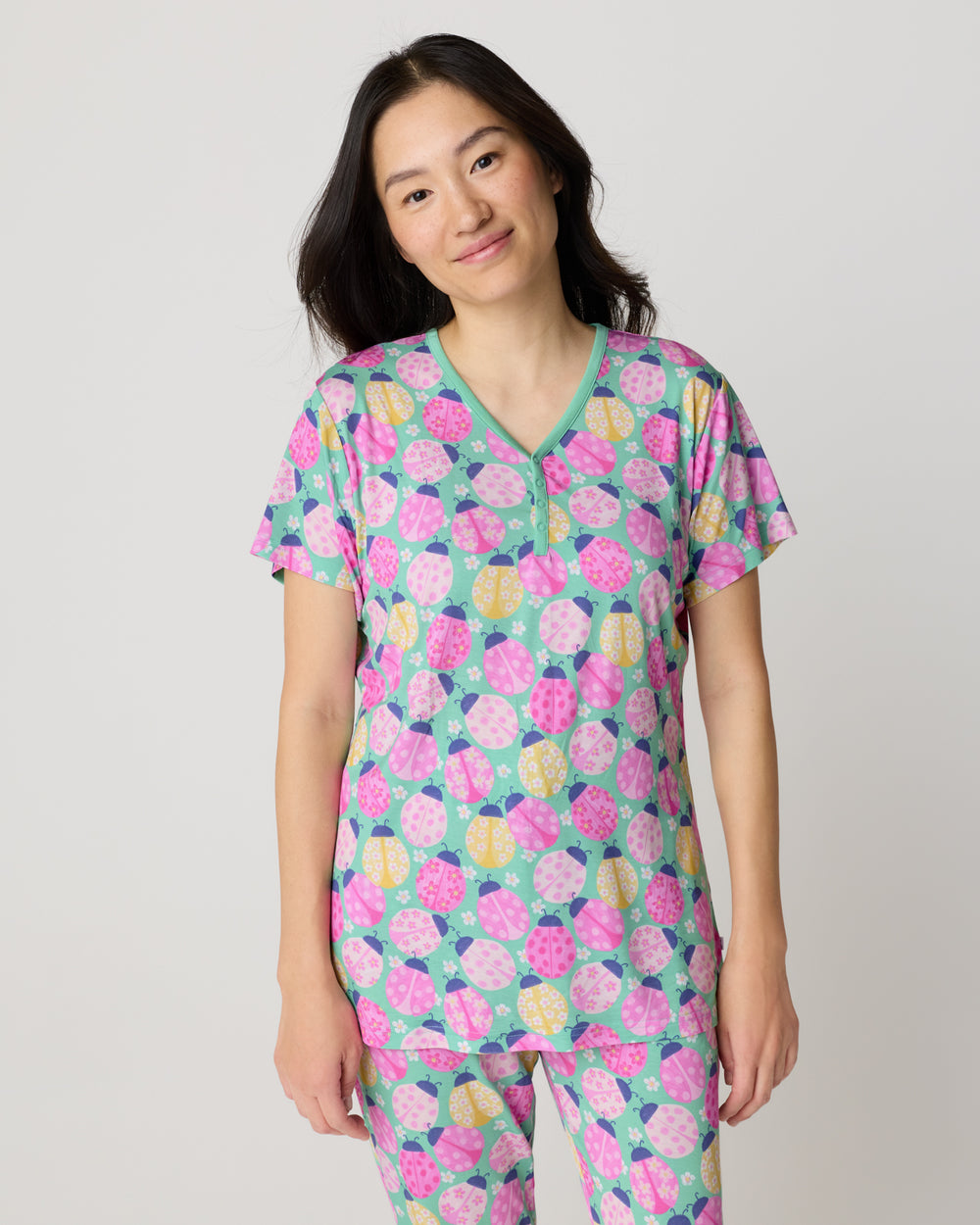 Woman wearing the Ladybug Meadow Women's Short Sleeve Pajama Top