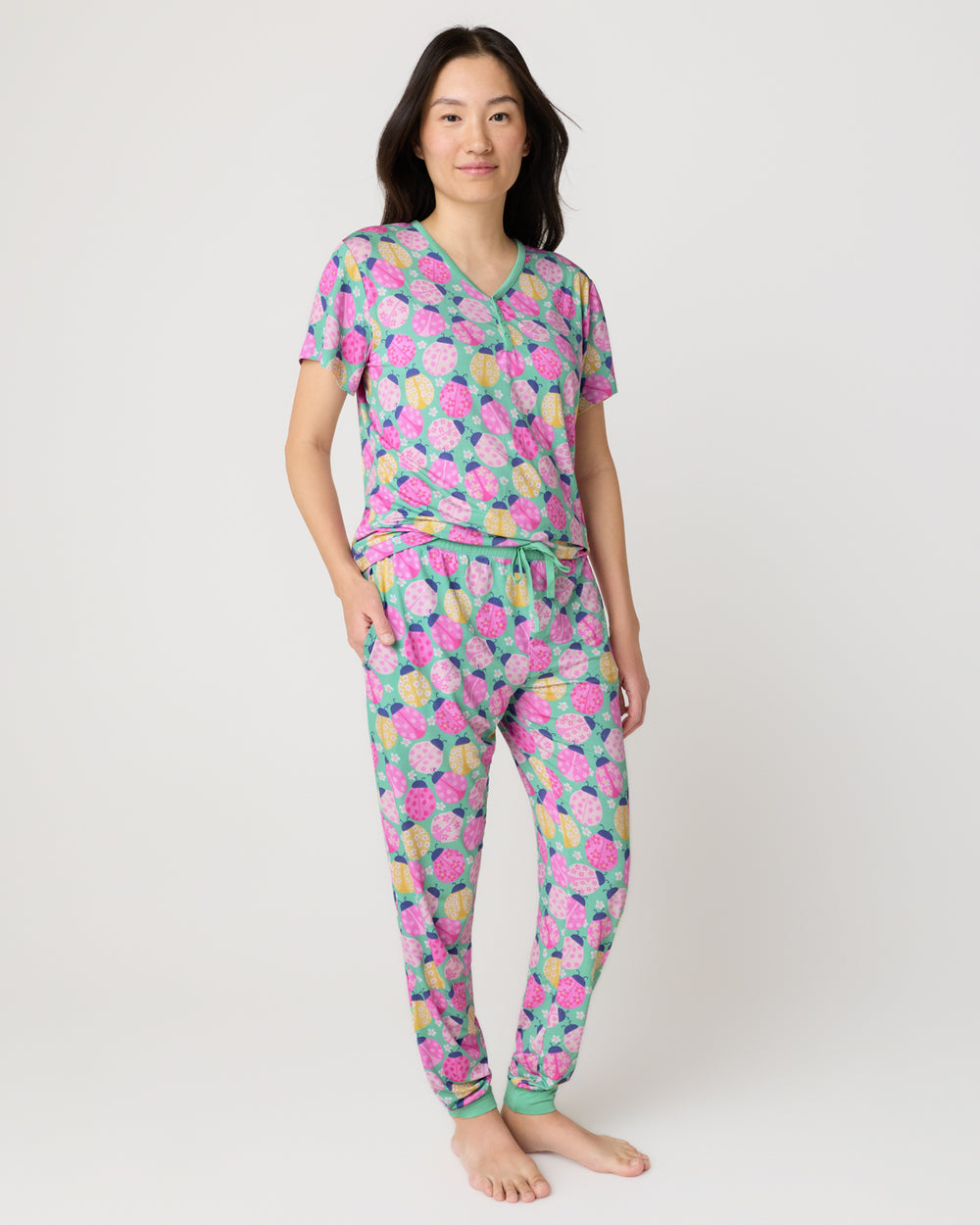 Woman wearing the Ladybug Meadow Women's Short Sleeve Pajama Top and Pants
