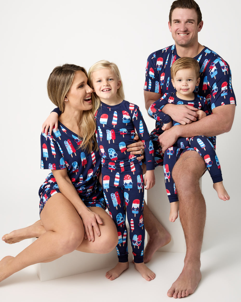 Family of four wearing the Sparkle Treats Fourth of July pajamas