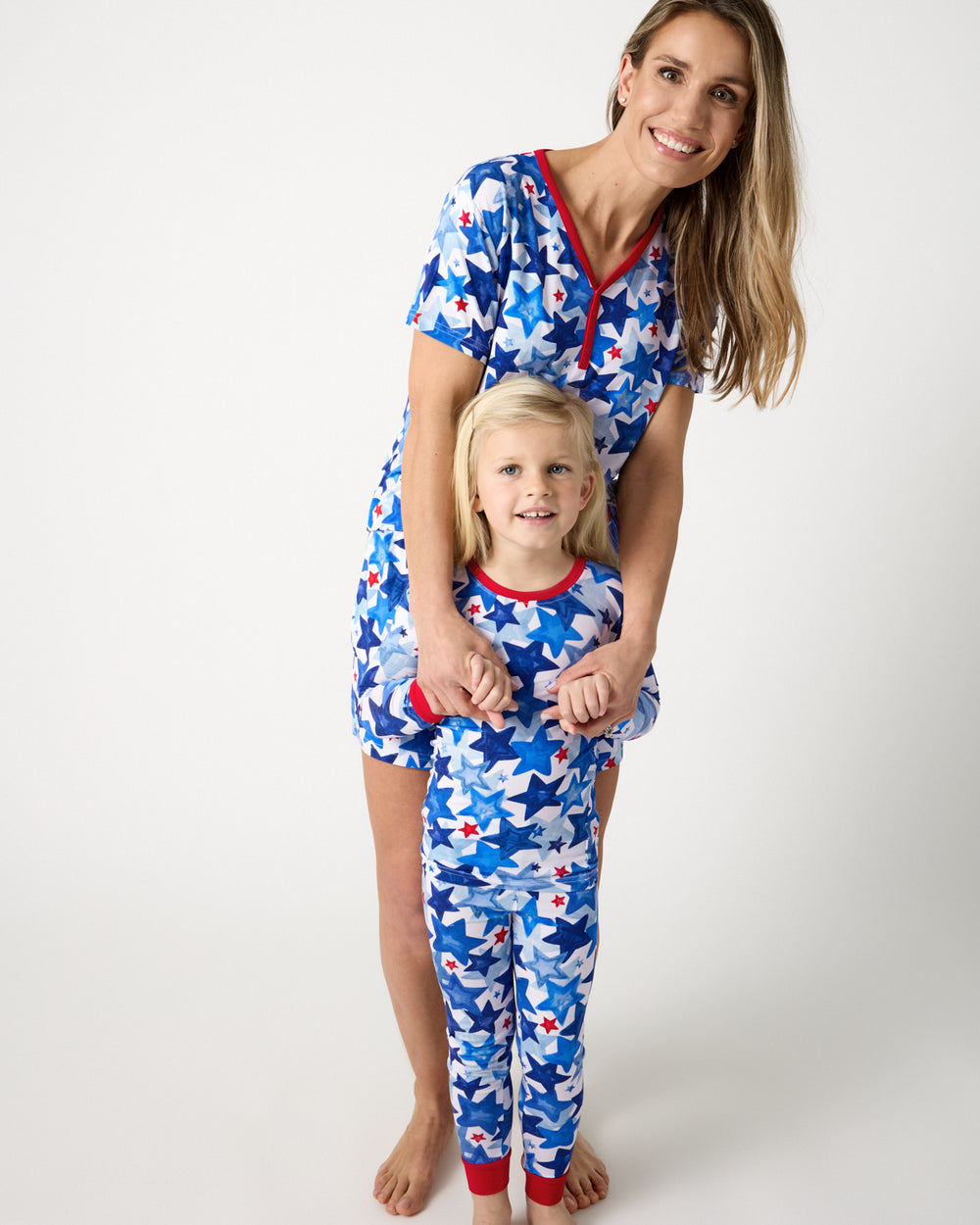 Mother and daughter wearing matching Starry Splash Pajama Sets