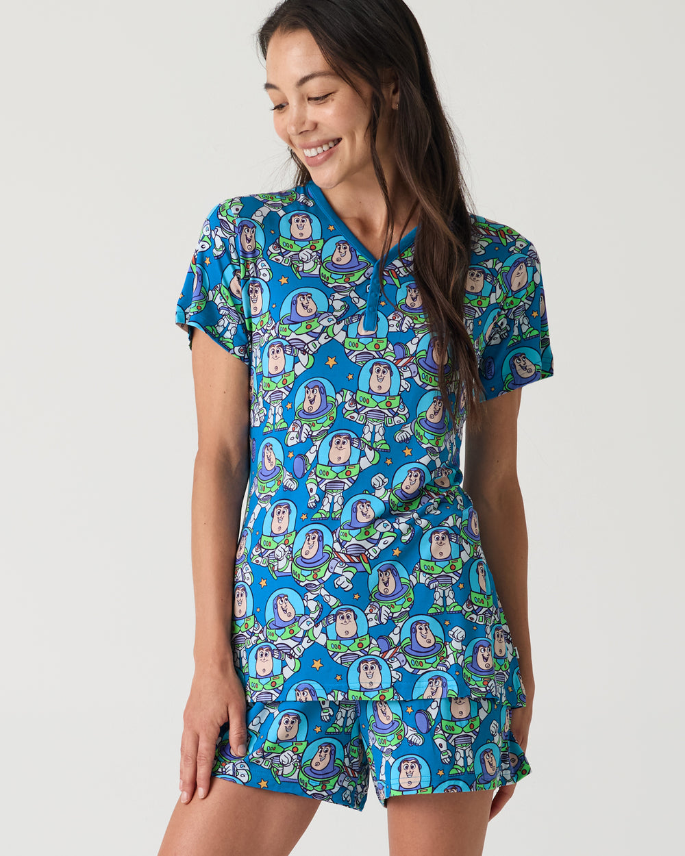 Woman wearing the Disney & Pixar Buzz's Cosmic Crew Women's Short Sleeve Pajama Top