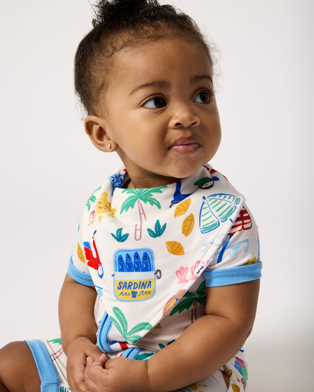 Baby wearing the Ciao Bella Bandana Bib