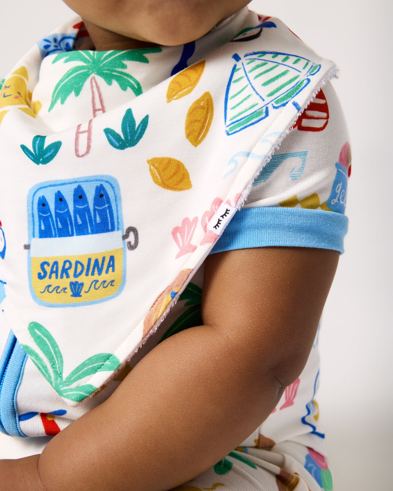 Close up of baby wearing the Ciao Bella Bandana Bib
