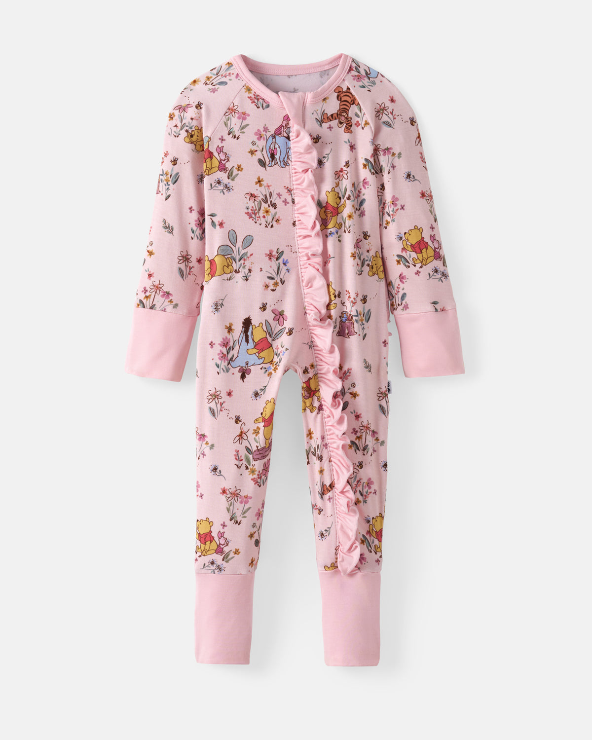 A pink long-sleeve baby jumpsuit featuring a floral and character print, a ruffled front placket, and ribbed cuffs and ankles, shown against a light gray background.