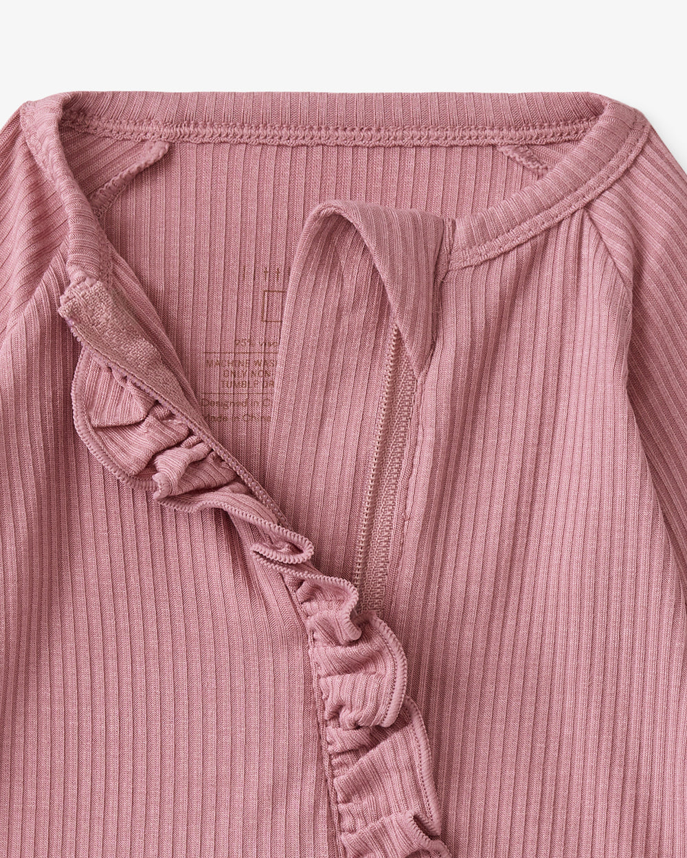 Close up of the neck opening on the Rosewood Ribbed Ruffle Zippy