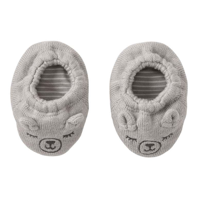 Pair of gray baby booties with animal face design on a white background