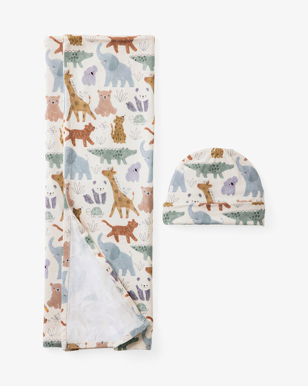 Flat lay of the Sweet Safari Swaddle & Infant Beanie Set