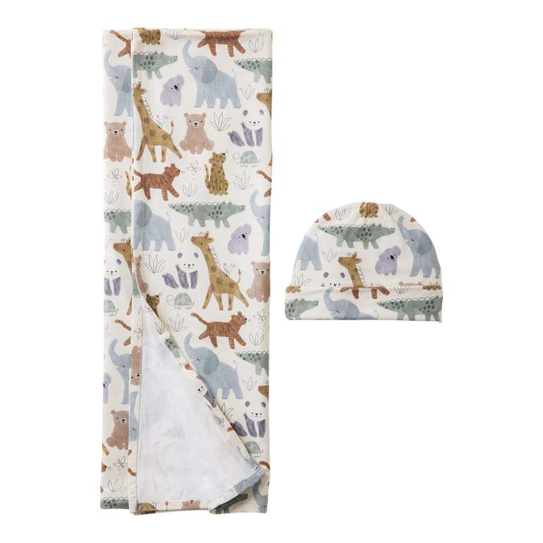Baby blanket and hat set with animal pattern on a white background