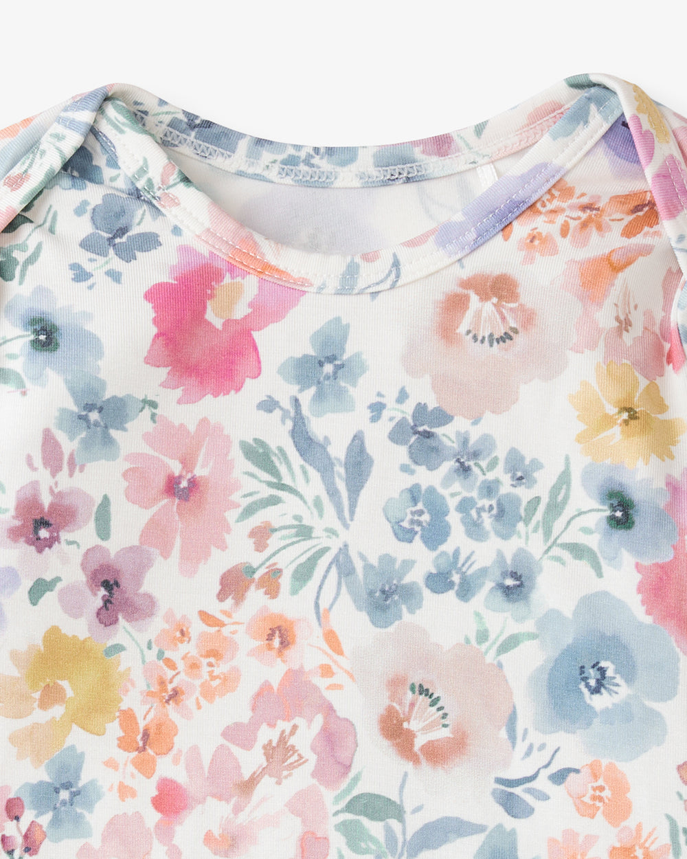 Close up flat lay of the neck opening on the Tiny Blooms Infant Gown