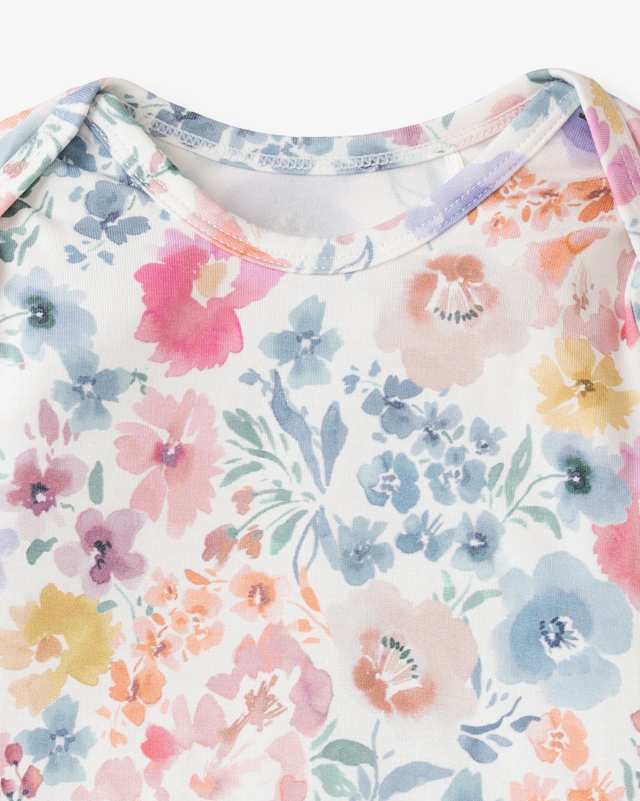 Close up flat lay of the neck opening on the Tiny Blooms Infant Gown