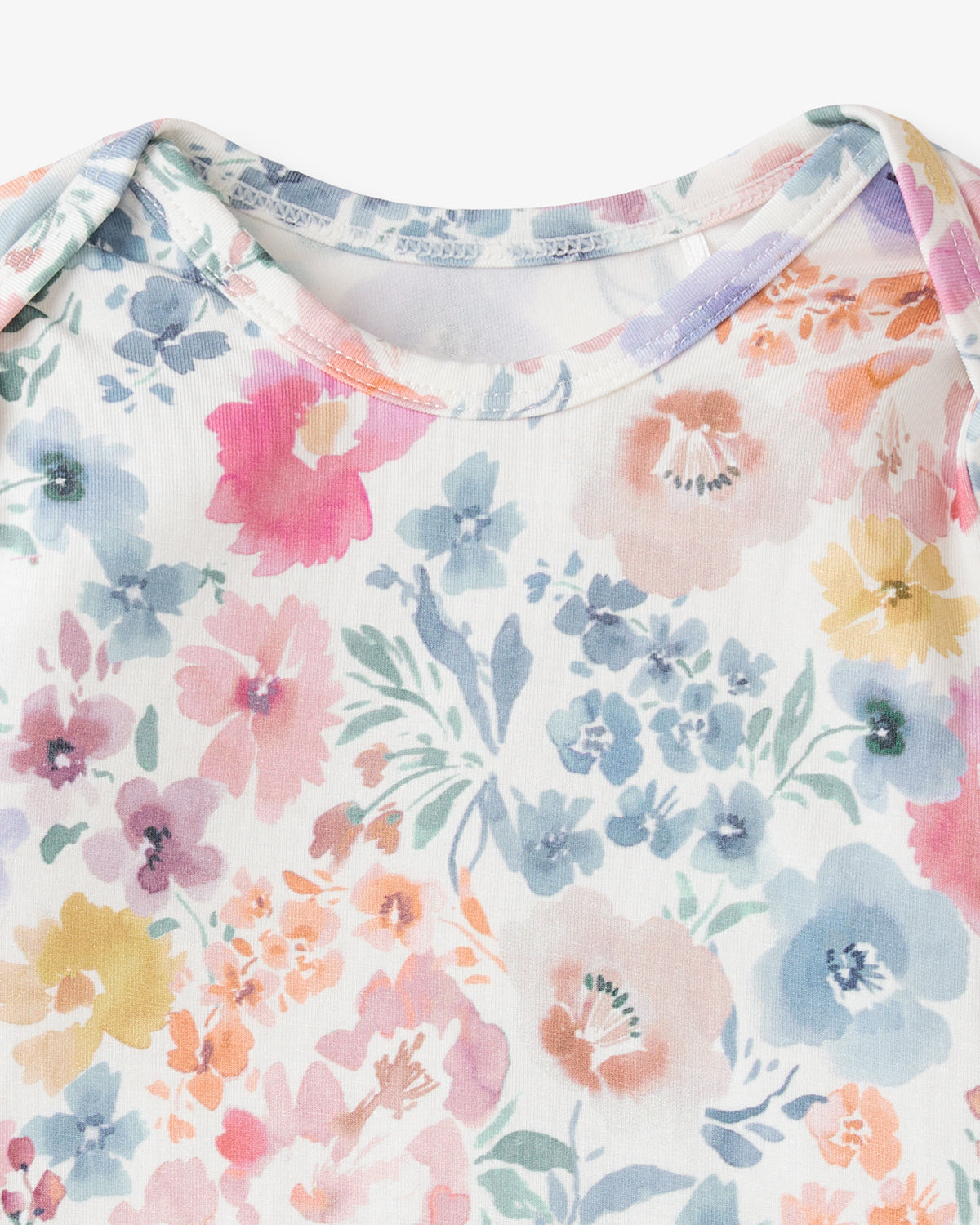 Close up flat lay of the neck opening on the Tiny Blooms Infant Gown