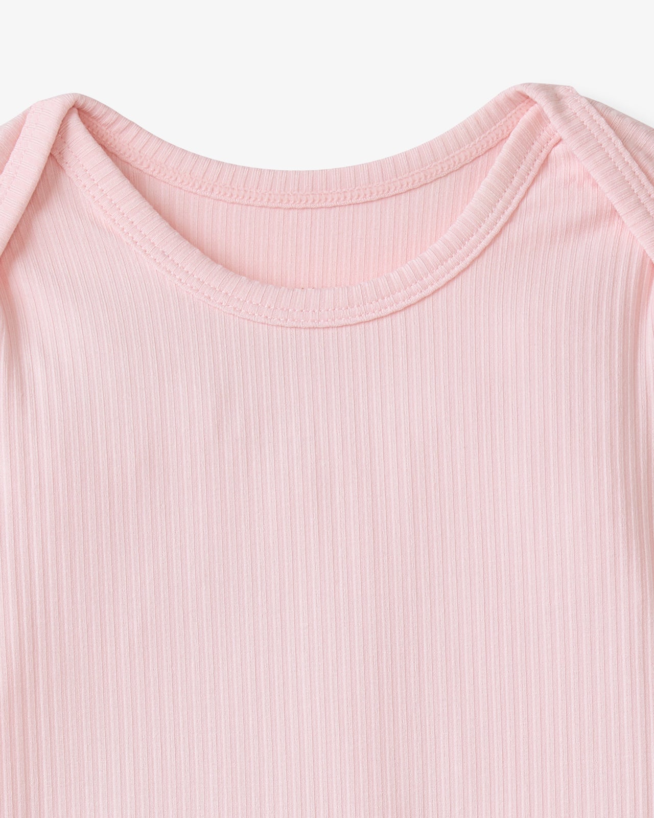 Close up flat lay of the neck opening on the Prima Pink Ribbed Infant Gown