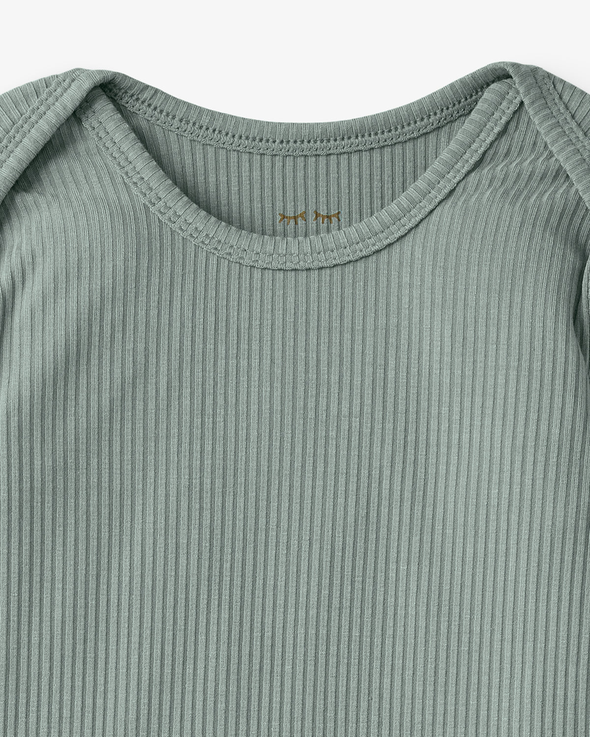 Close up flat lay of the neck opening on the Willow Ribbed Infant Gown