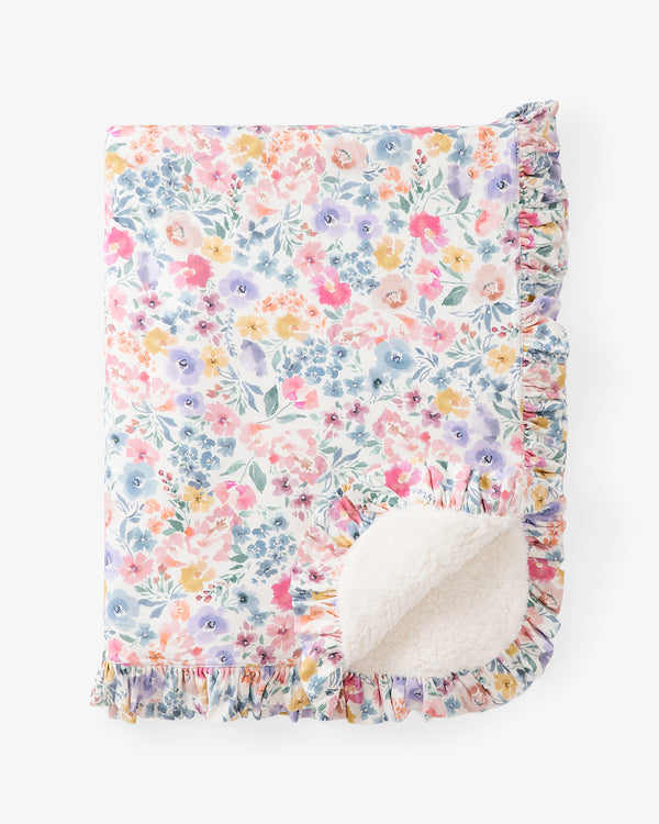 Flat lay of the Tiny Blooms Ruffle Mini Cloud Blanket