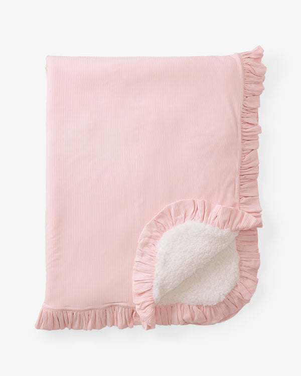 Flat lay of the Prima Pink Ribbed Ruffle Mini Cloud Blanket
