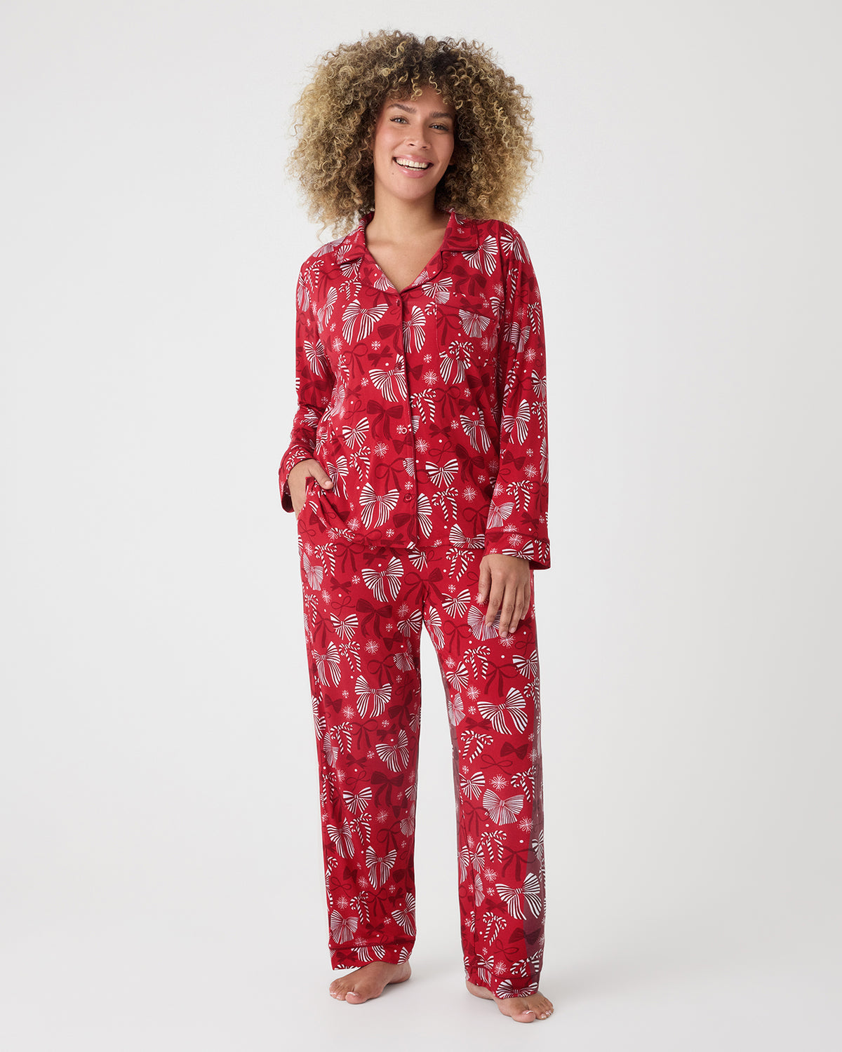 Woman wearing the Holiday Bows Women's Long Sleeve Pajama Set
