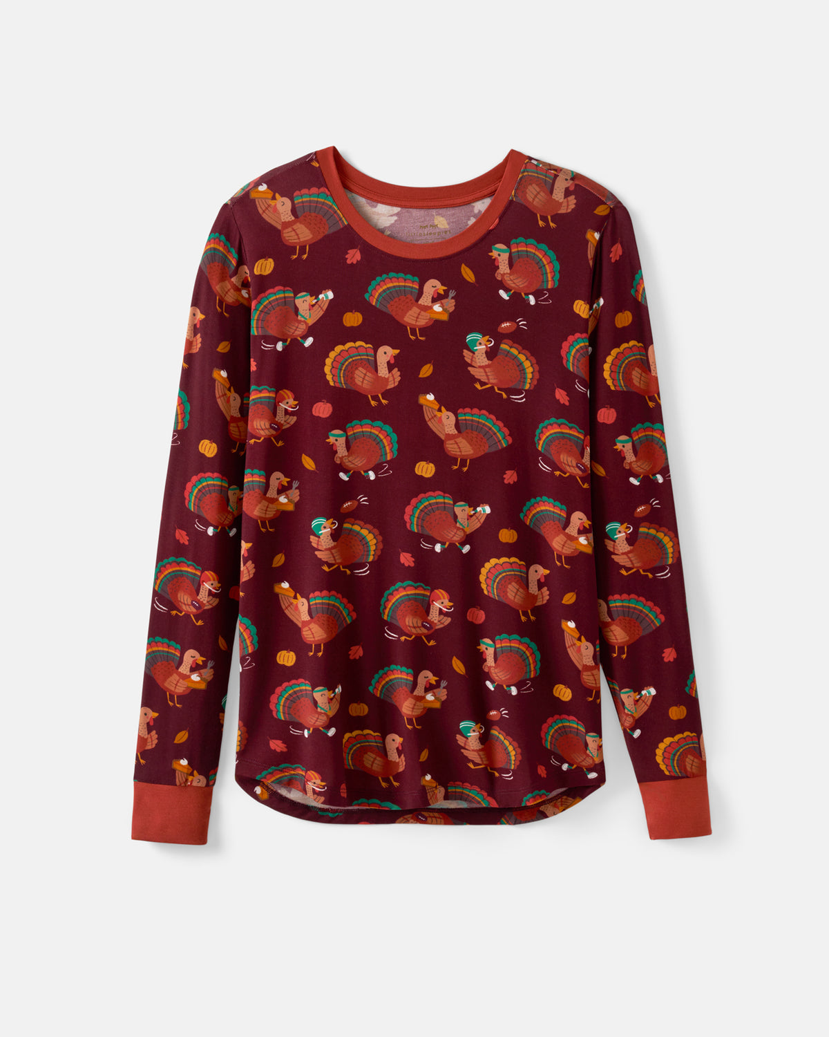 A long-sleeve crewneck shirt with a repeating Thanksgiving turkey pattern on a dark burgundy background, featuring solid rust-orange cuffs and collar, shown against a light gray background.