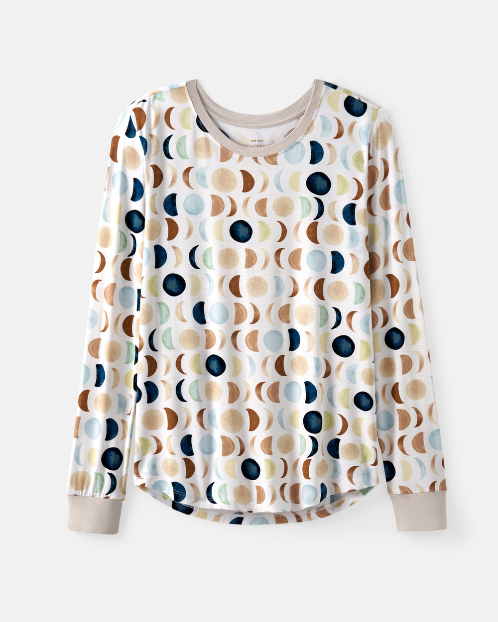 A long-sleeve crewneck PJ top with a white base and an all-over abstract pattern of moon phases in navy, beige, brown, and light blue, shown on a light gray background.