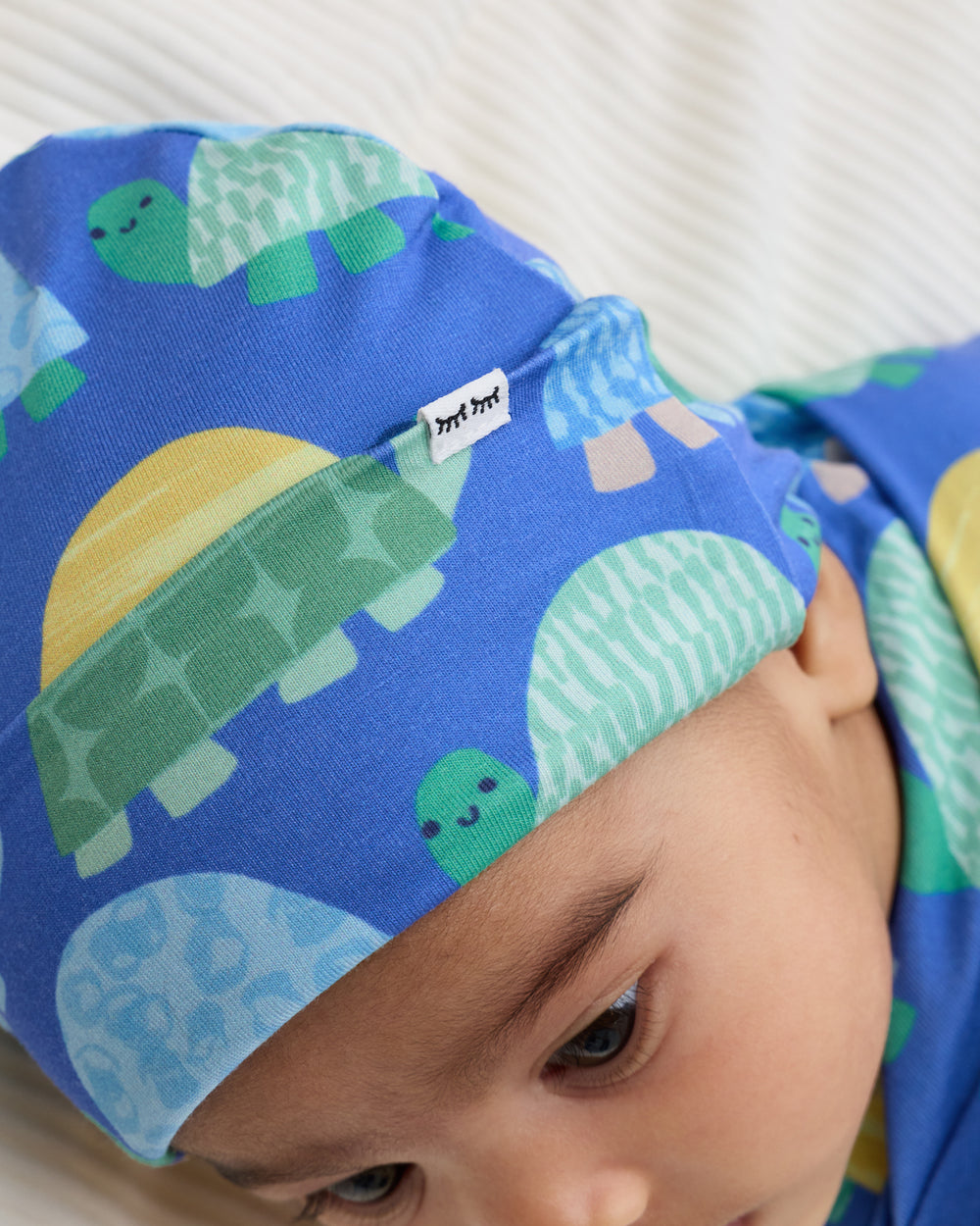 Close up of the hat in the Shell Parade Swaddle & Hat Set