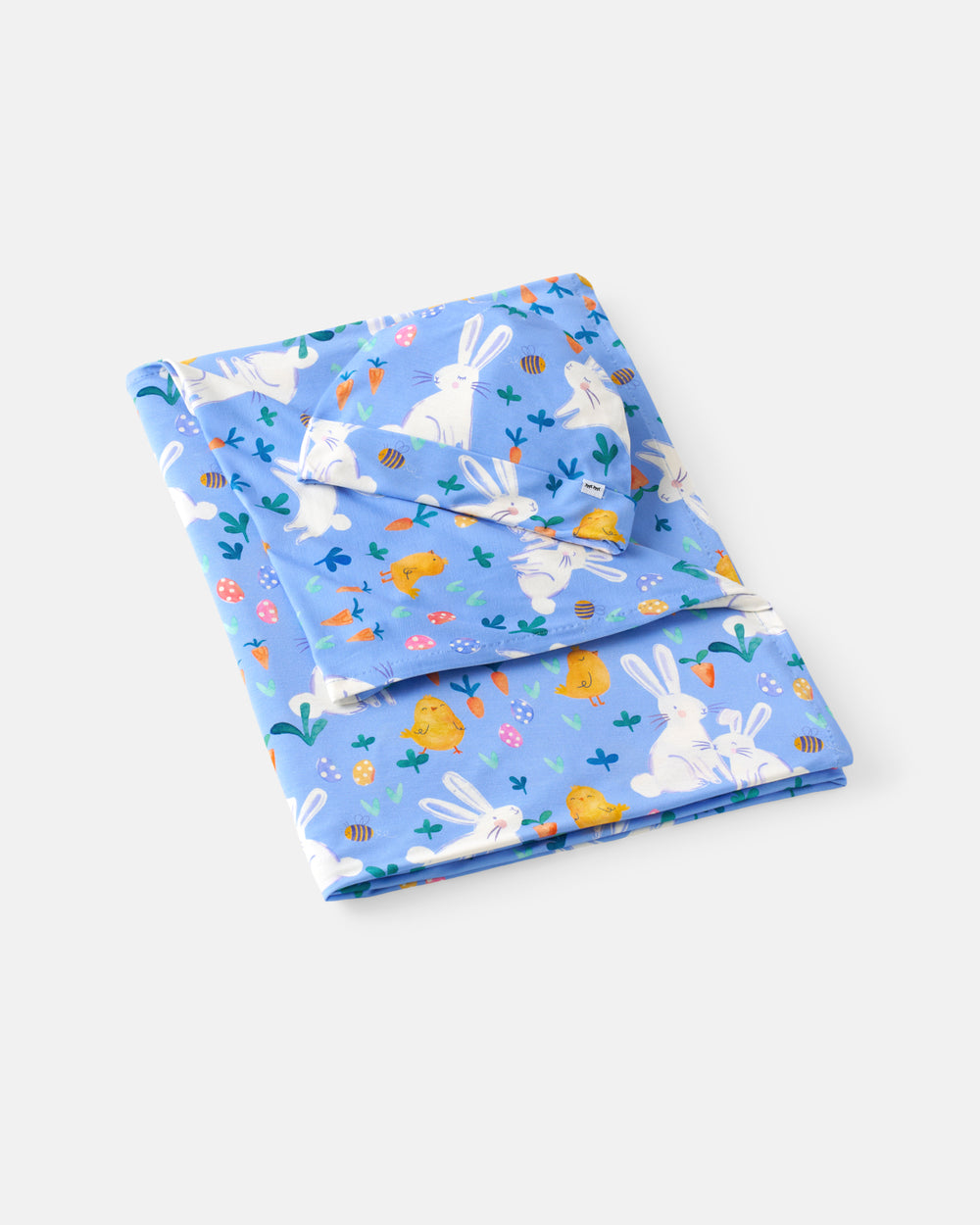 Flat lay of the Bunny Patch Swaddle & Hat Set