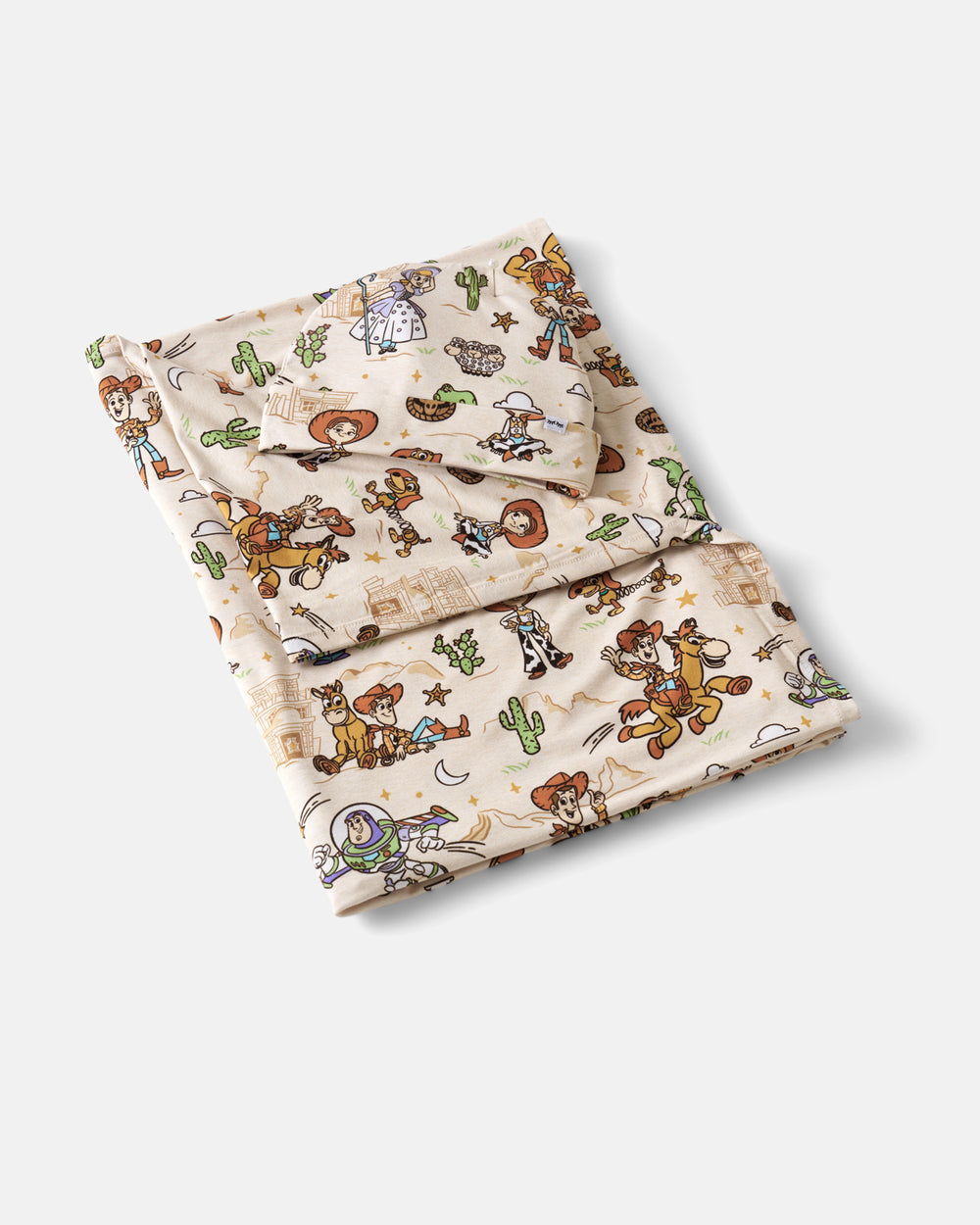 Flat lay of the Disney & Pixar Woody's Wild West Swaddle & Beanie Set