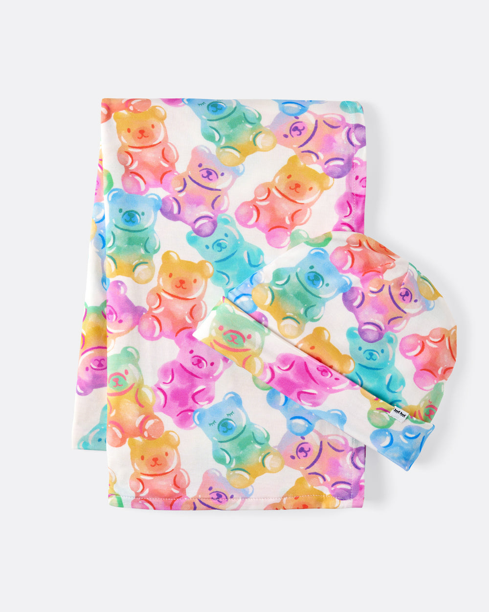 Flat lay of the Gummy Giggles Swaddle & Beanie Set