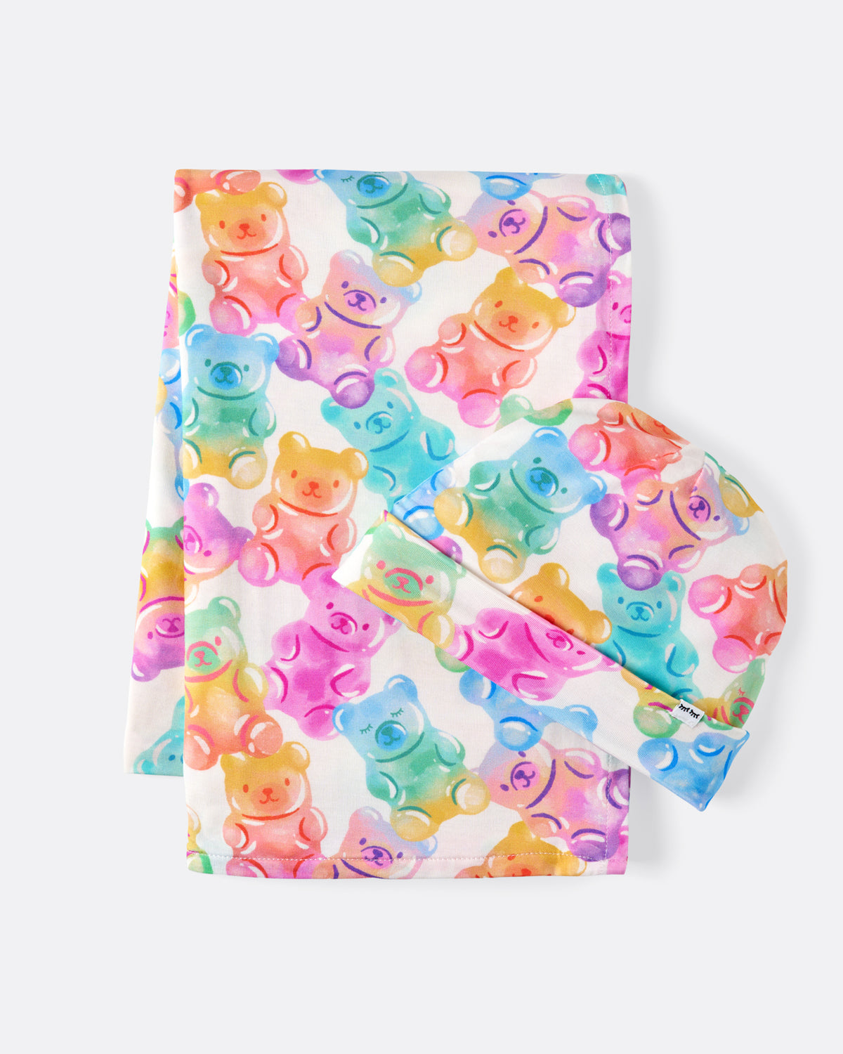 Flat lay of the Gummy Giggles Swaddle & Beanie Set