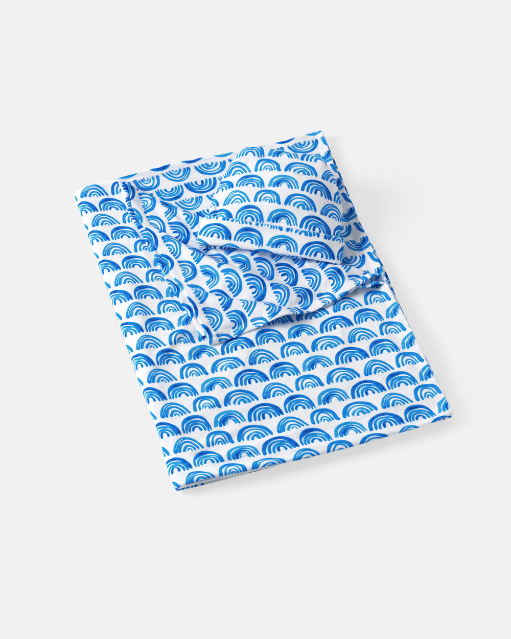 Flat lay of the Blue Rainbows Swaddle & Beanie Set