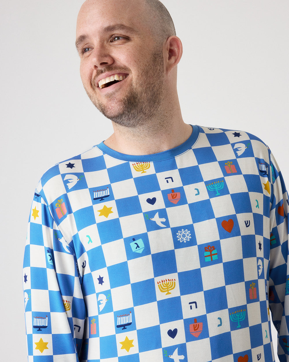 Close up of man wearing the Hanukkah Checks Men's Pajama Top