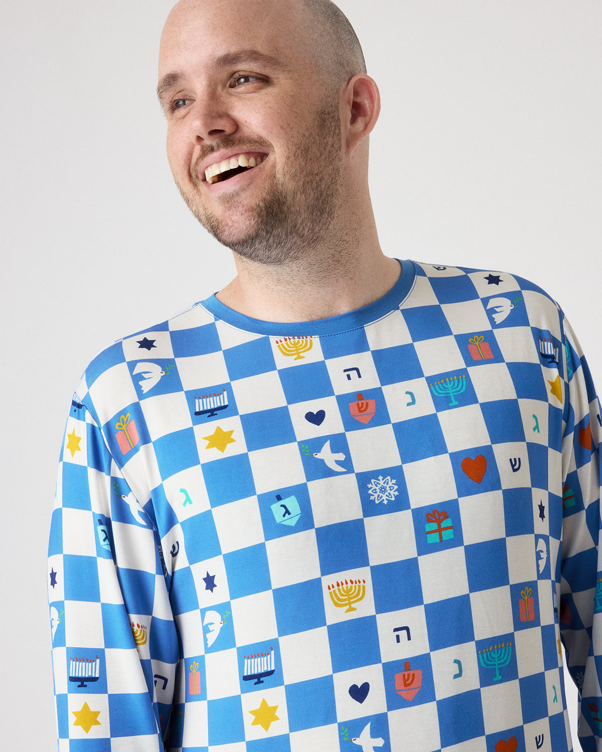 Close up of man wearing the Hanukkah Checks Men's Pajama Top
