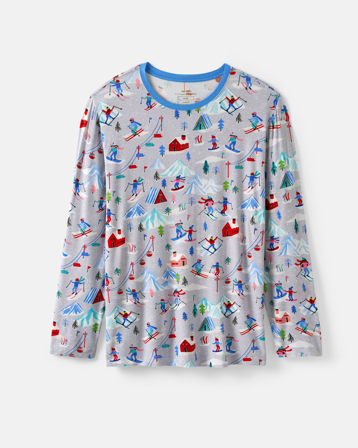A long-sleeve crewneck shirt with a light gray base, featuring an all-over colorful winter ski resort print with skiers, snowboarders, mountains, and cabins. It has a contrasting blue crew neck collar.