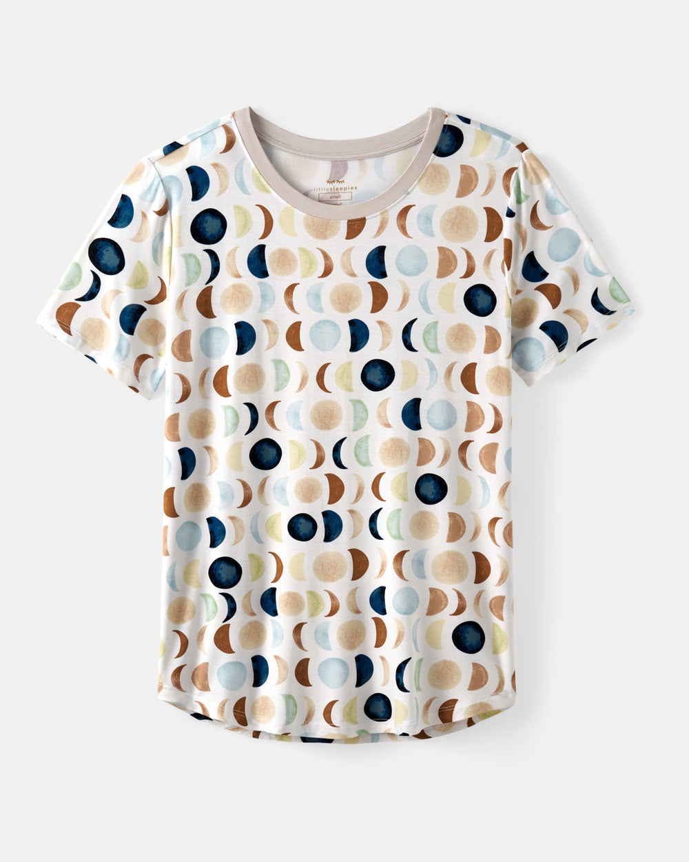 A short-sleeve crewneck t-shirt featuring an all-over repeating pattern of abstract moon phases in navy blue, beige, brown, and light blue on a white background.