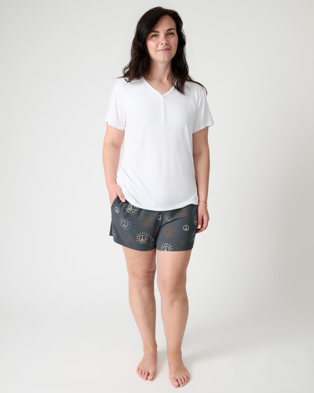 Standing woman wearing the Peace & Love Ribbed Women's Pajama Shorts and White PJ Top