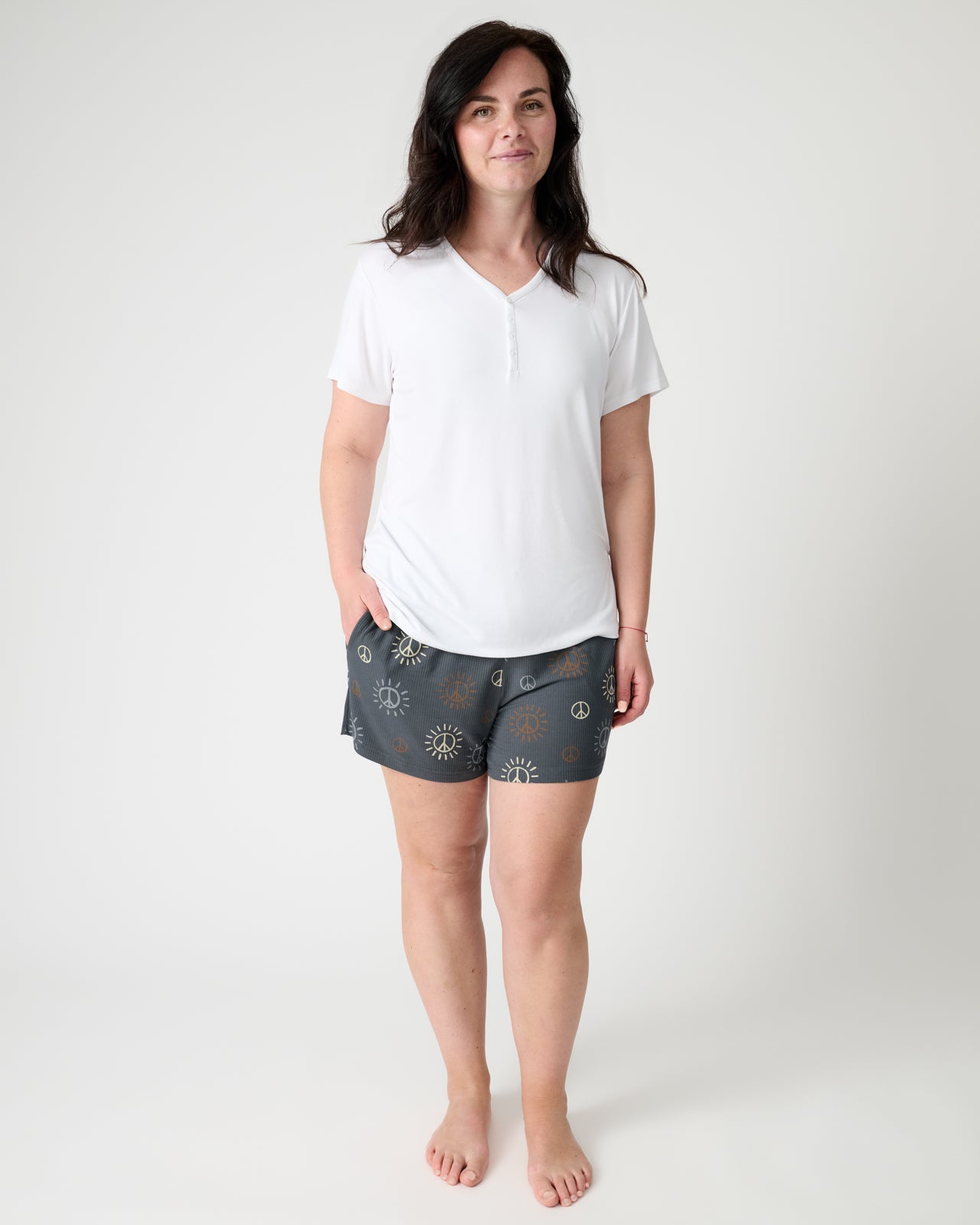 Standing woman wearing the Peace & Love Ribbed Women's Pajama Shorts and White PJ Top