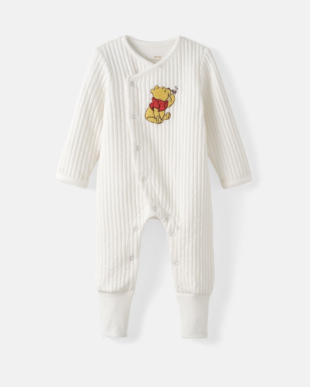A white ribbed long-sleeve baby footless one-piece romper featuring a Winnie the Pooh embroidered graphic on the chest, displayed against a light gray background.