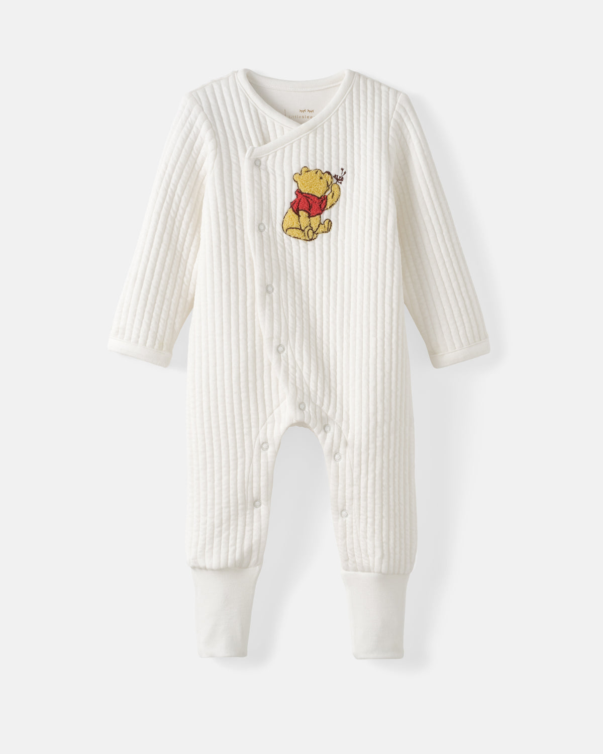 A white ribbed long-sleeve baby footless one-piece romper featuring a Winnie the Pooh embroidered graphic on the chest, displayed against a light gray background.