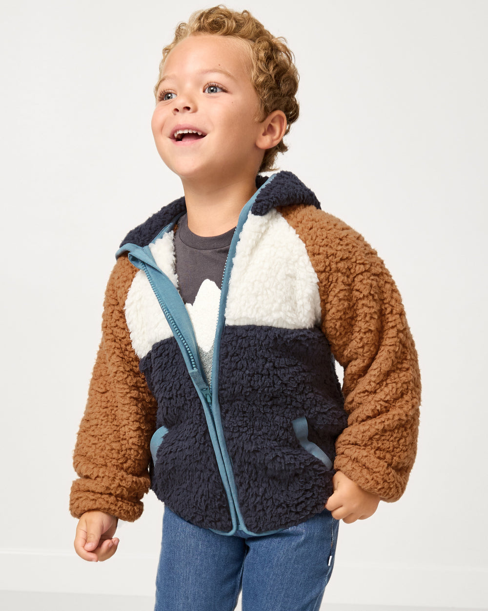 Child wearing the Shadow Gray Sherpa Jacket