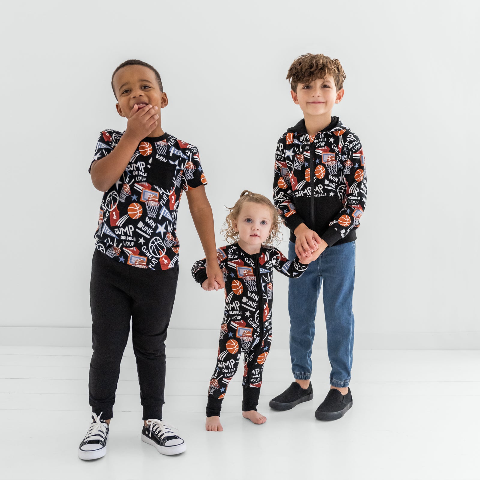 Three children wearing matching Black Slam Dunk styles