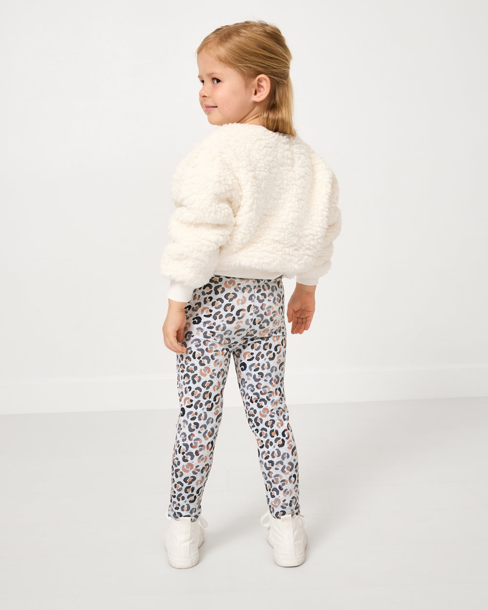 Back view of girl wearing the Leopard Drop Shoulder Crewneck