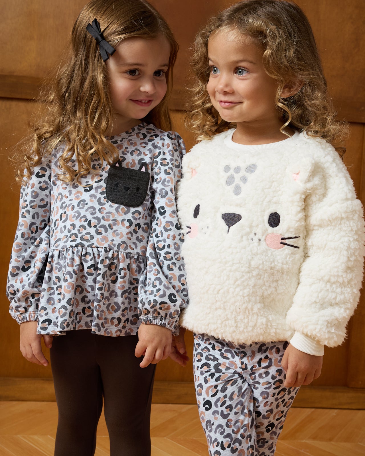 Two girls wearing styles from the Winter Play collection
