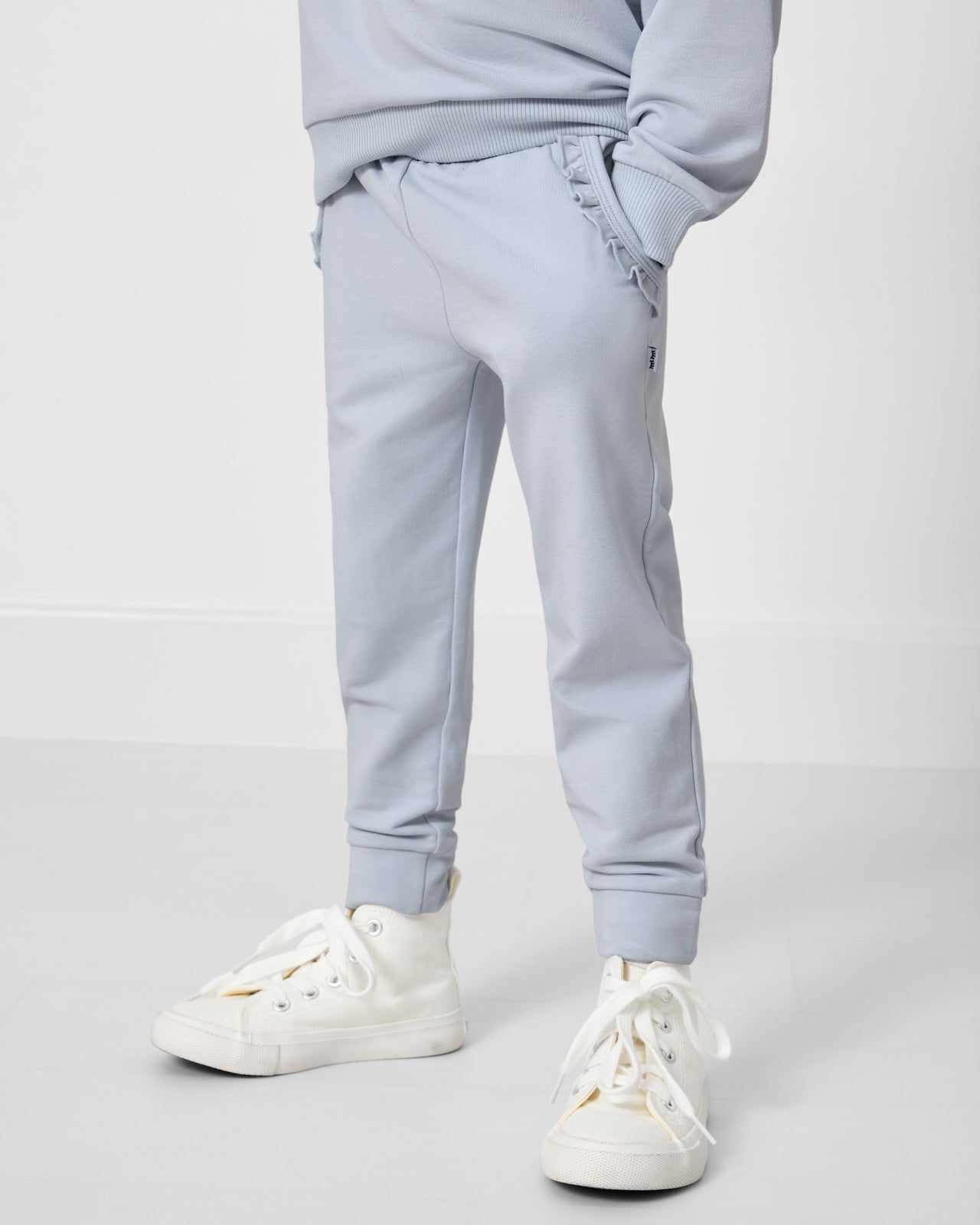 Girl wearing the Soft Blue Ruffle Jogger