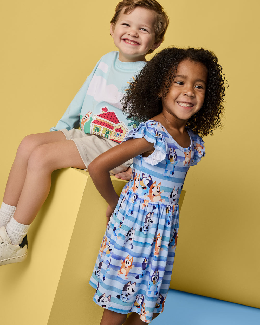 Two children wearing daywear styles from the Bluey Dance All Day Collection