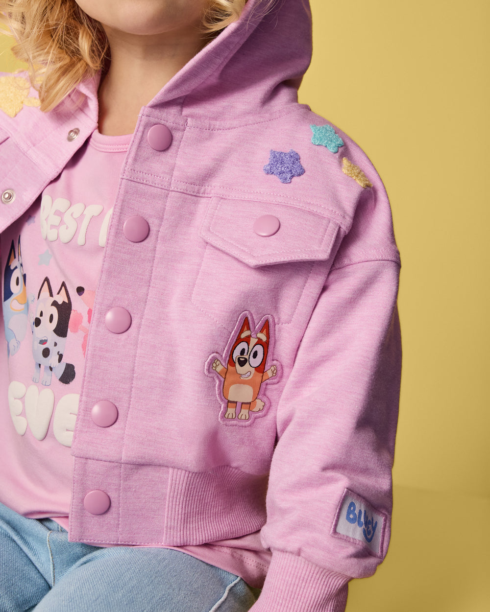 Close up of the chest pocket detail on the Bluey Friends Forever Hooded Trucker Jacket