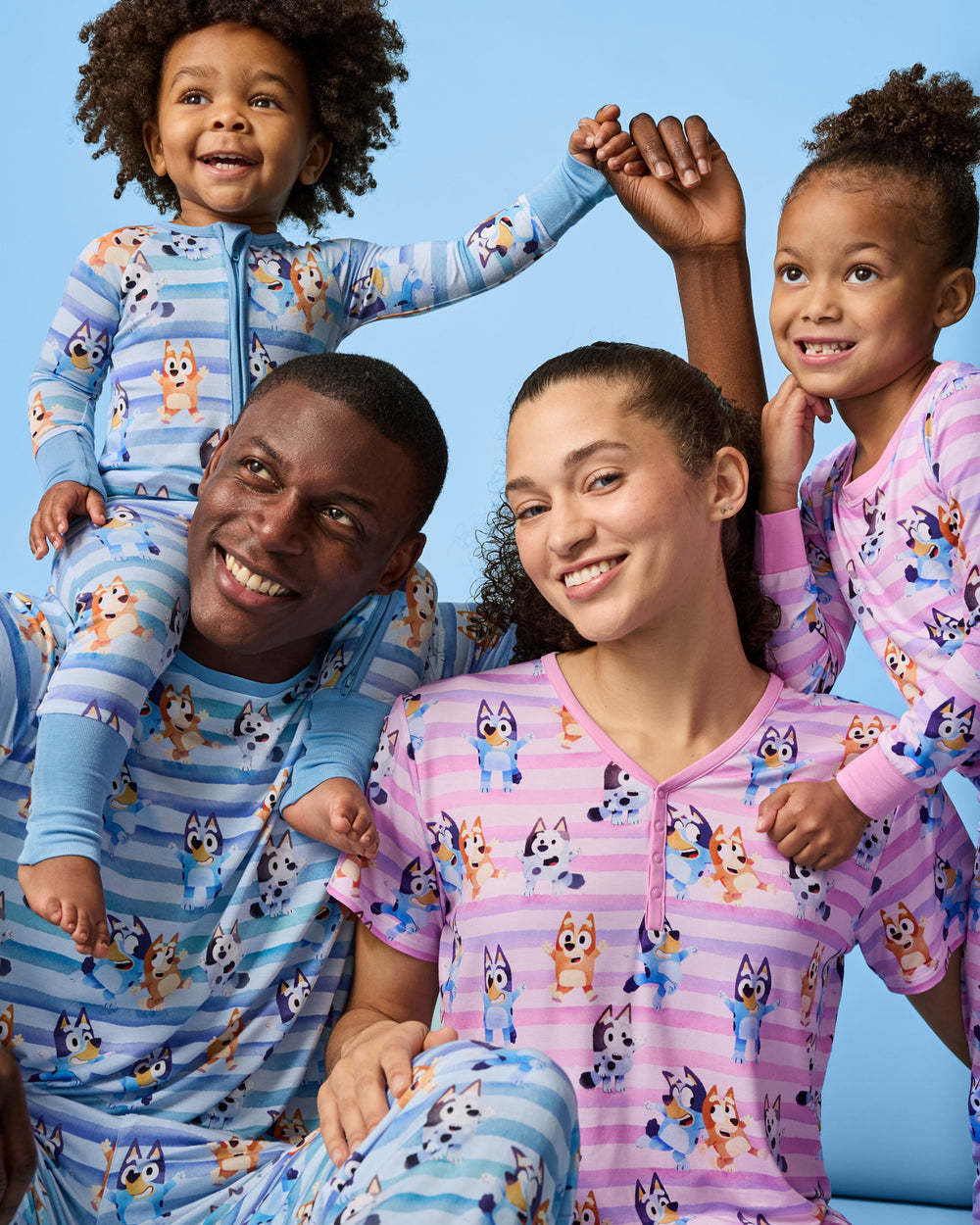 Family of four wearing matching Bluey Dance All Day Pajamas