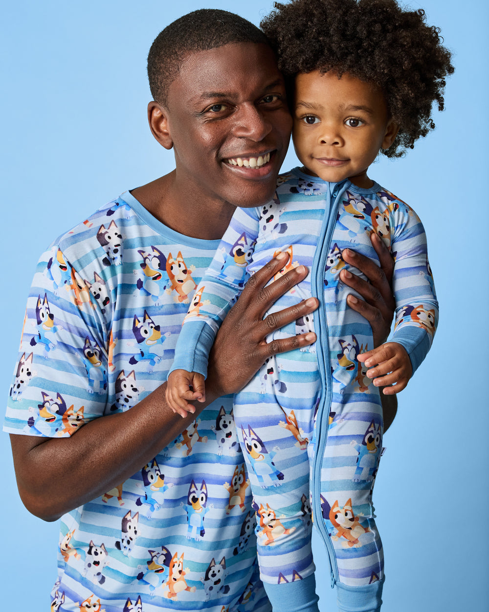 Father and son wearing matching Bluey Dance All Day Pajamas