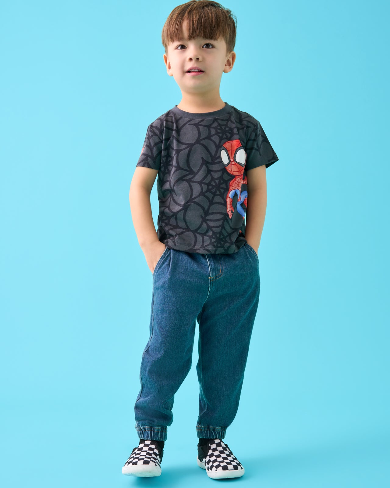 Boy wearing the Spidey & Friends Relaxed Tee with denim joggers