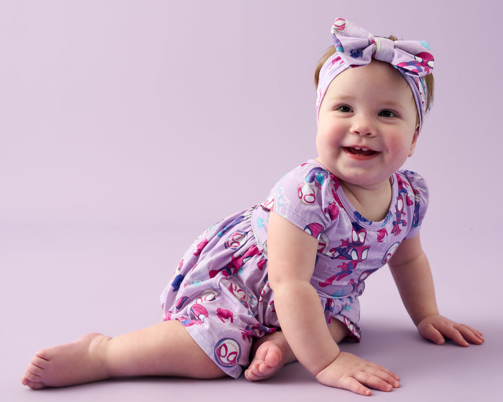 Crawling baby wearing the Spidey & Friends Tiny Webs Skater Dress with Bodysuit