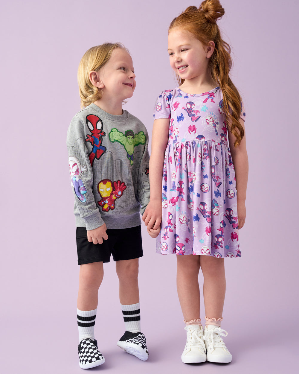 Two children wearing Spider-man Play styles  
