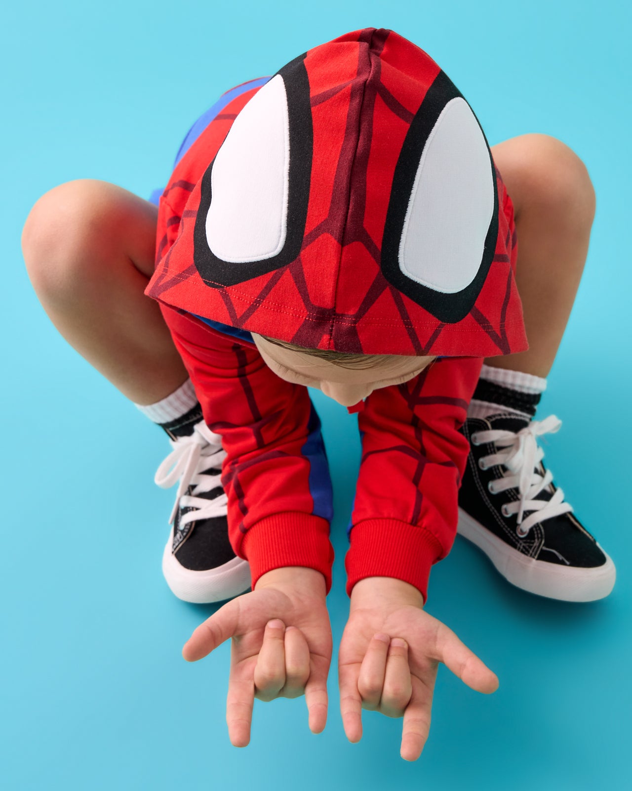 Posing boy wearing the Spidey Zip Hoodie