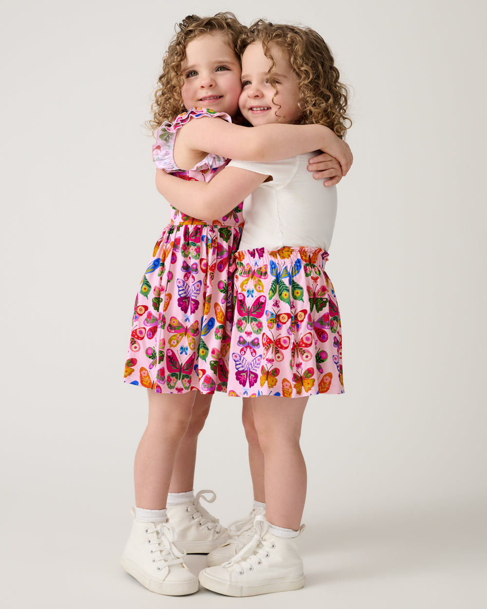 Twins wearing matching Flutter Garden styles